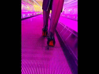 A girl wearing black nylons stockings and high heels